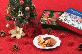 「シック＆エレガンス」をコンセプトとする洋菓子メーカーロイスダールがお届けするクリスマス2025「夜空をかけるサンタ」デザインの心温まる冬の焼菓子ギフトを販売