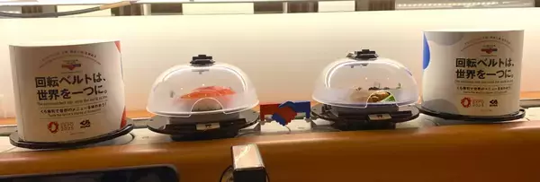 「大阪・関西万博に参加する70か国・地域の代表料理を再現！くら寿司 70種類の「万博特別メニュー」を公開　～万博応援企画も2025年2月7日(金)より全国の店舗で開始～」の画像