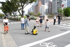 移動ロボットの屋外自動走行実験「中之島チャレンジ」を企画・実施 -- 大阪工業大学