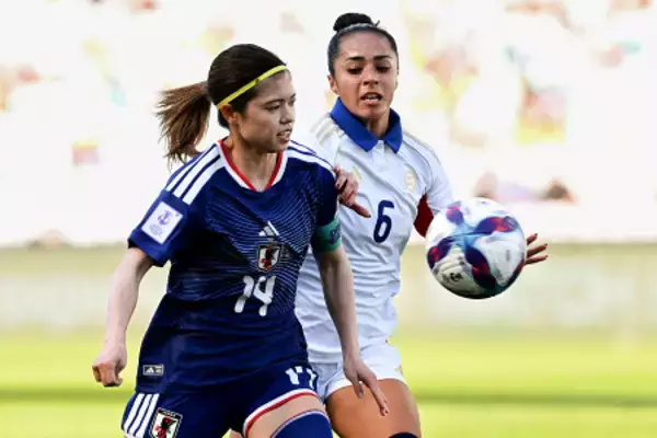 競り合う長谷川