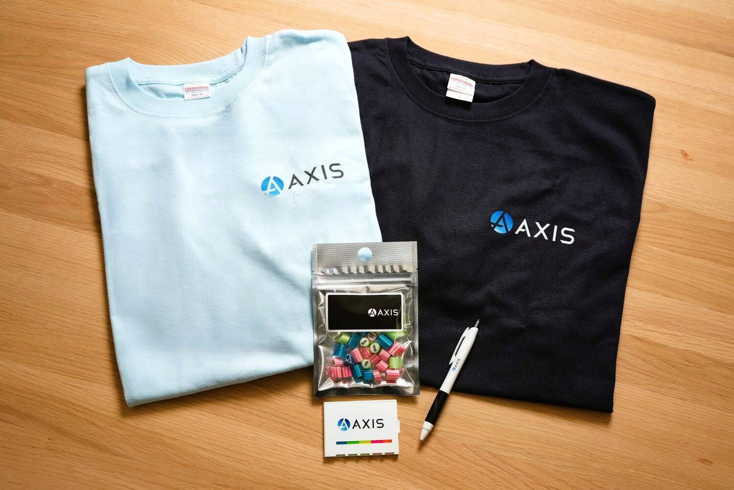 社員一人ひとりがブランドアンバサダー「AXISブランドアンバサダーチャレンジ」 ～5,000個の新ロゴグッズ活用でブランド浸透～