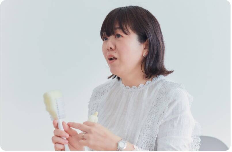 びん底にたまるミルクまで早く、きれいに、確実に。ーバイヤーの開発への想いを綴るー