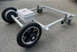 「ビニールハウスなどに設置されたレール上を、自動走行する汎用電動台車を開発」の画像1
