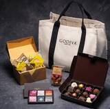 「ゴディバ「2023 ブラックフライデー ハッピーバッグ」、ボックス型トートバッグにチョコレート・クッキーなど詰めた福袋、11月17日発売」の画像5