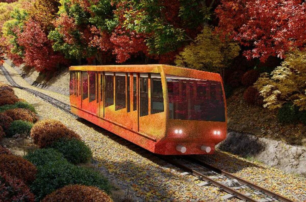 高尾山ケーブルカーが隈研吾デザインでリニューアル！ 絶景が広がる「架線レス」新型車両や大屋根駅舎の見どころを解説（2028年春デビュー）
