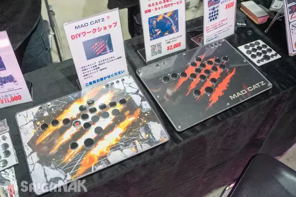 「【EVO Japan 2026】Mad Catz、PUNK WORKSHOP × Good 8 Squadブースレポート！コラボアパレルや大量のコラボモデルアケコンなど」の画像
