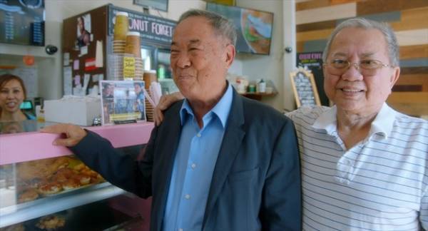 笑顔だけでは終わらない？“ドーナツ王”の素顔捉えた場面写真『ドーナツキング』