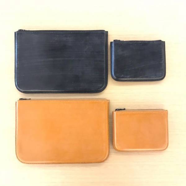 サイ マーカンタイルのクラッチバッグ - 使い込むほど味が出るブライドルレザーの輝き