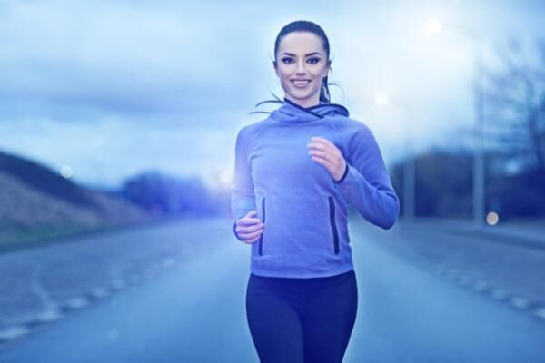 woman jogging outdoors in the evening