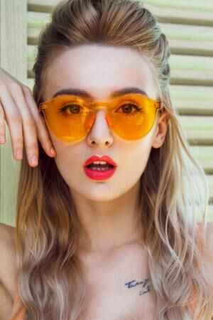 Beautiful woman with orange sunglasses
