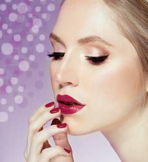 woman with red lips and manicure