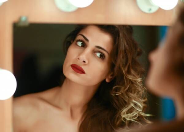 Actress Applies Makeup Backstage