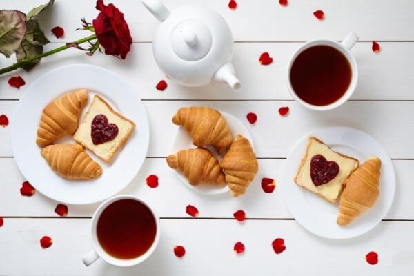 Breakfast for couple on Valentines Day with toasts, heart shaped