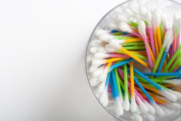 Colorful cotton swabs arranged in a cup