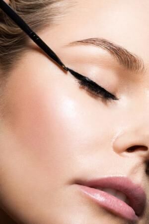 Close-up make-up with black eyeliner
