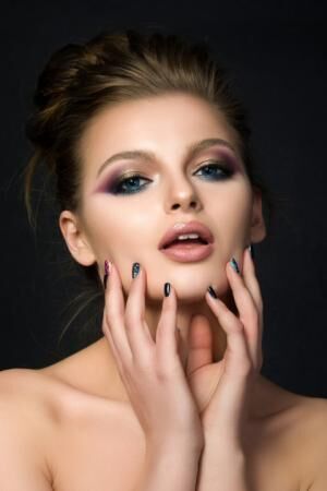 Portrait of young beautiful woman with blue eyes