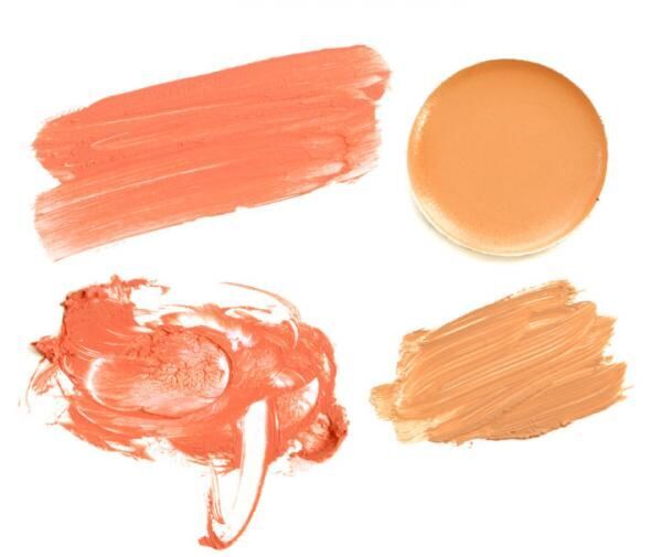 Set of smudge orange creamy eyeshadow on white background