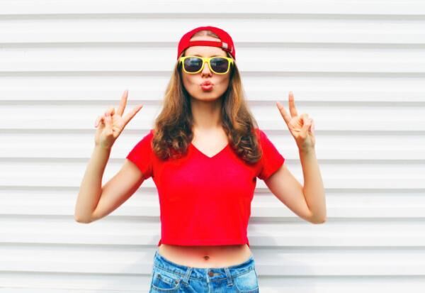 Fashion pretty cool woman in sunglasses and red t-shirt