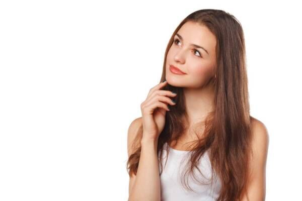 woman thinking looking to the side at blank copy space