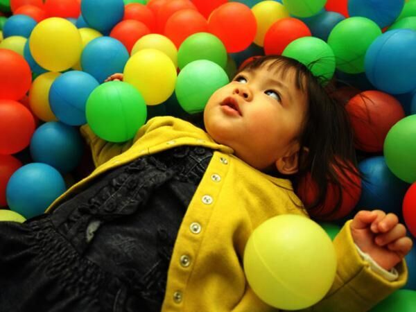 Japanese baby girl playing in ball pool (1 year old)