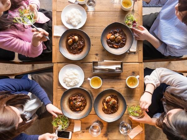 Elevated view of four women eating.