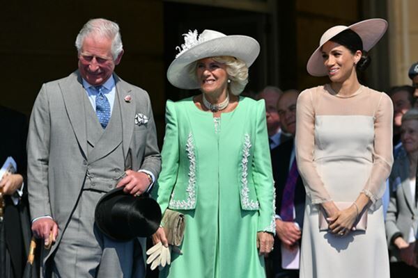 2018年5月、挙式後初の公務でチャールズ皇太子夫妻と園遊会に出席したメーガン夫人（写真：代表撮影/ロイター/アフロ）