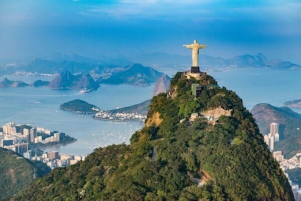Aerial view of Rio De Janeiro. Corcovado mountain with statue of Christ the Redeemer overlooking Rio De Janeiro landscape. Photographed from helicopter.