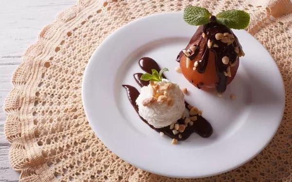 poached pear with chocolate and ice cream.